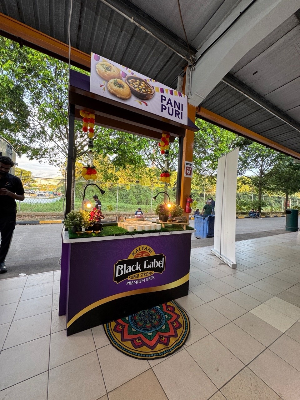 Pani puri food station set up at a sheltered outdoor event