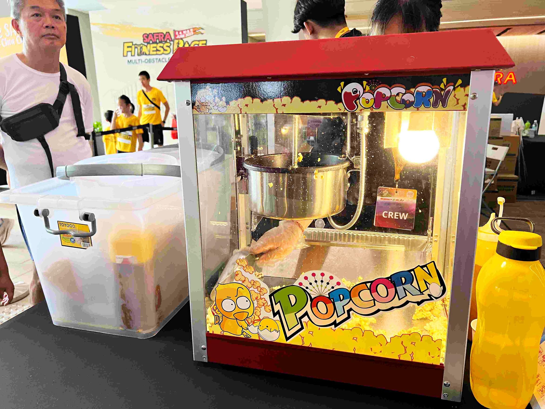 Popcorn machine serving guests at an indoor event