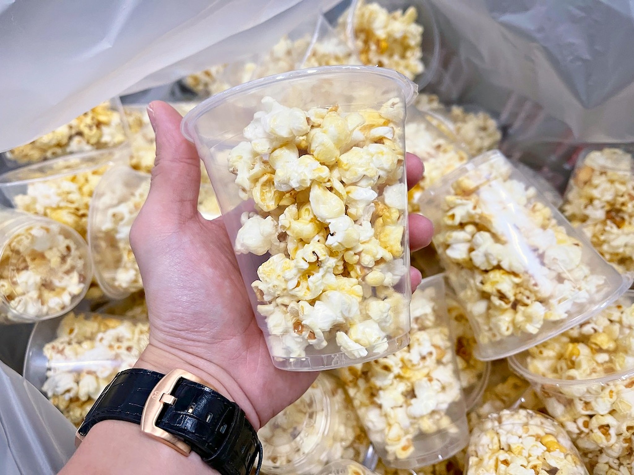 Individual clear cups filled with popcorn