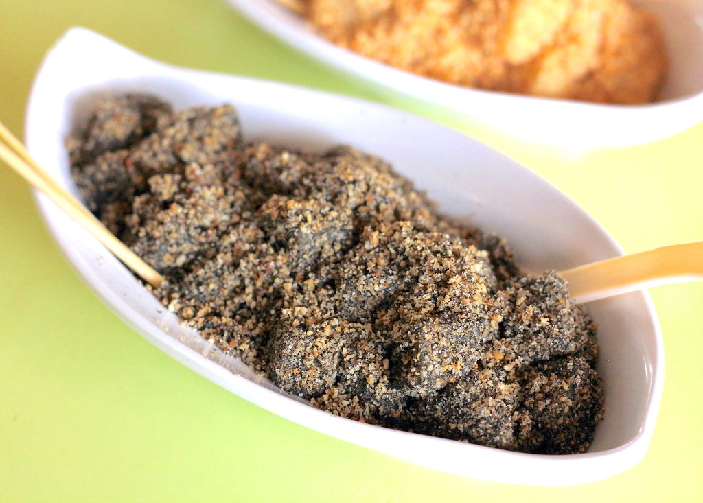 Black sesame muah chee served in a white bowl