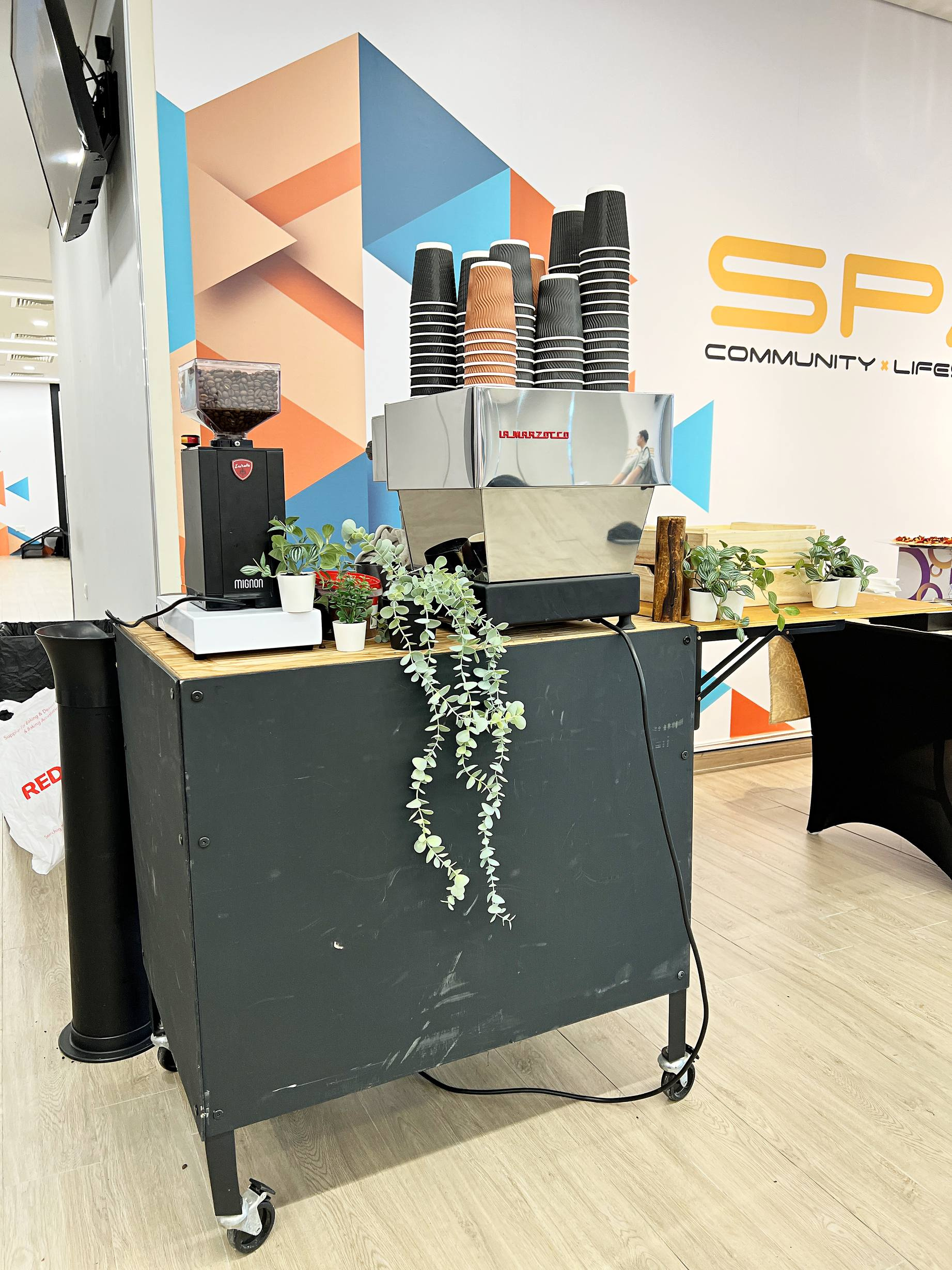 Mobile coffee cart with espresso equipment and cups