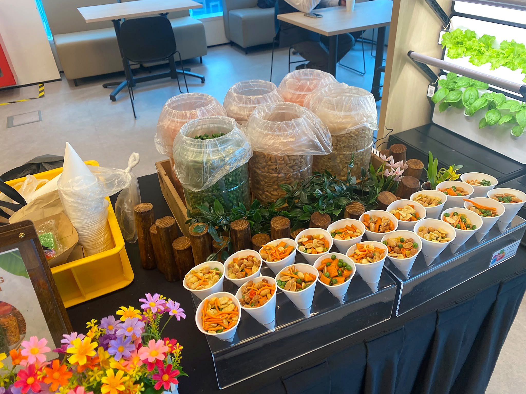 Kacang puteh jars and snack cups arranged on a counter