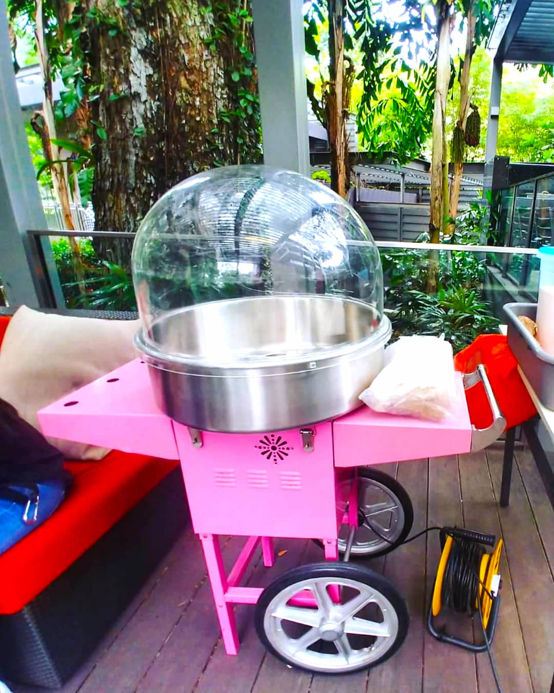 Pink candy floss cart with a clear bowl cover