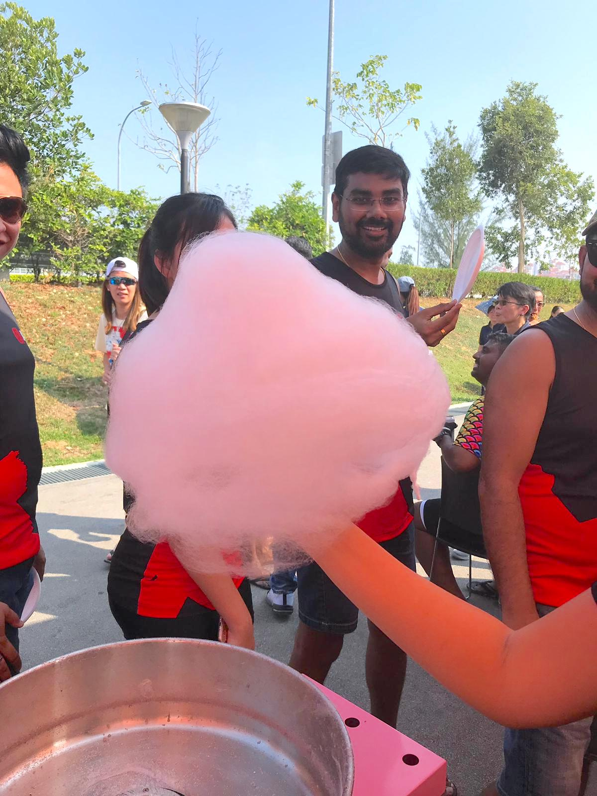 Pink candy floss portion at an outdoor gathering