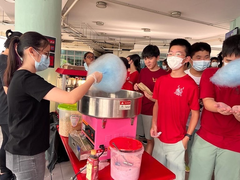 Blue candy floss being made at a school event