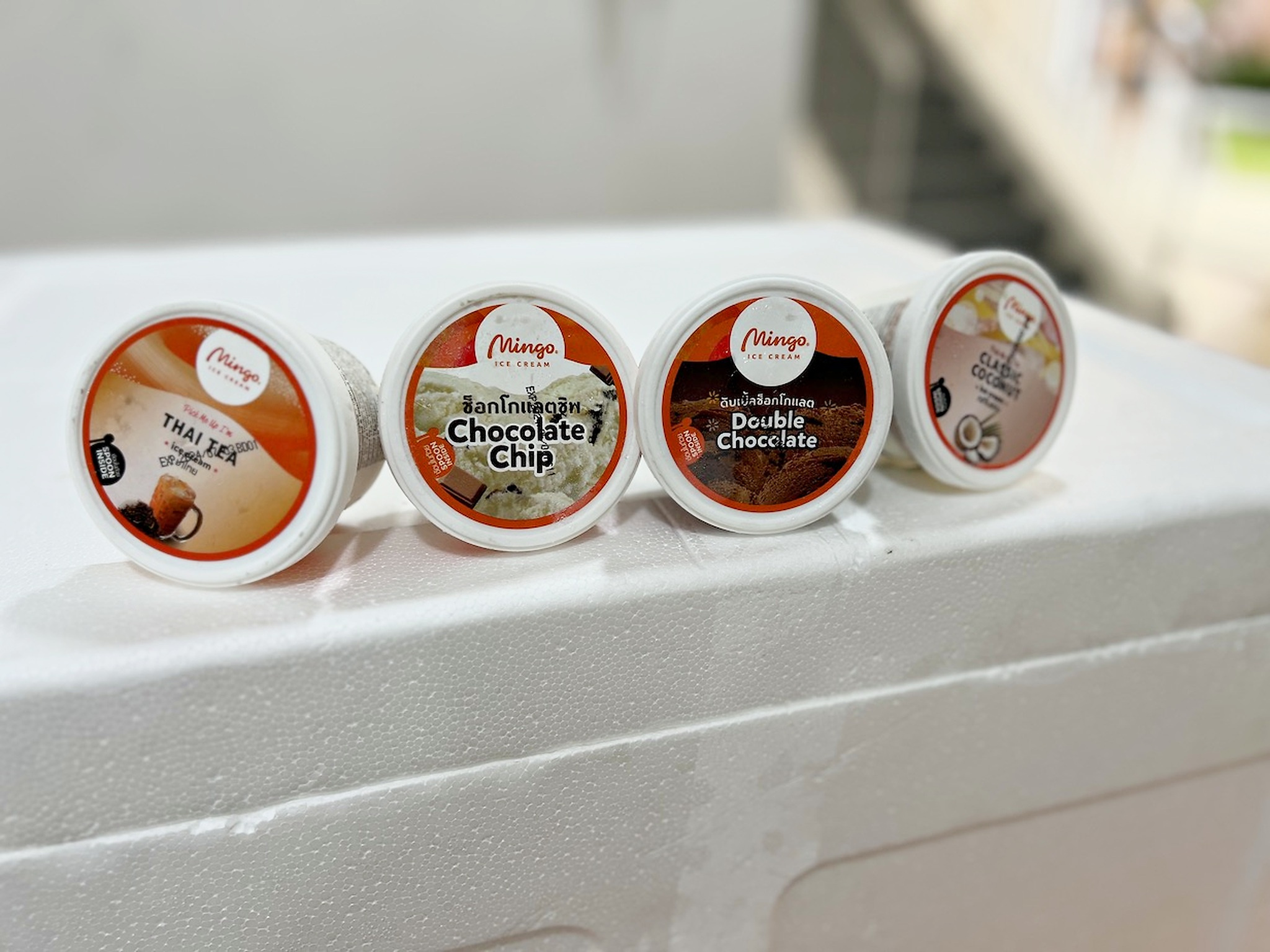 Mingo ice cream cup flavours displayed on a cooler