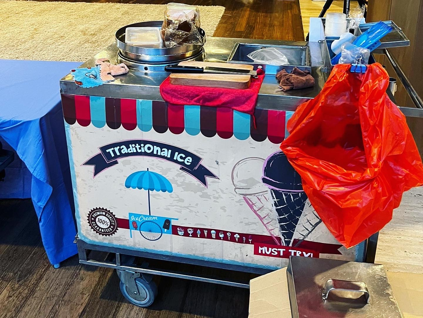 Traditional ice cream cart with utensils and service supplies