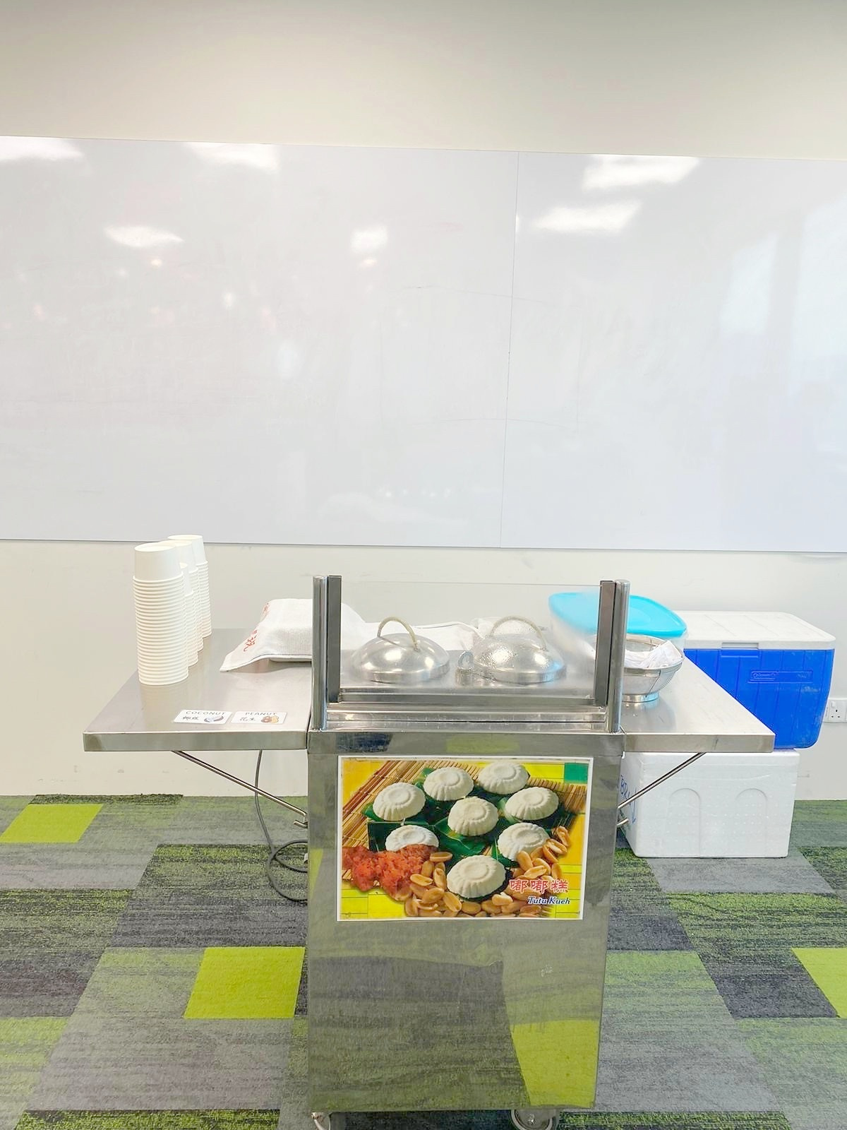 Tutu kueh steamer cart set up for an indoor event