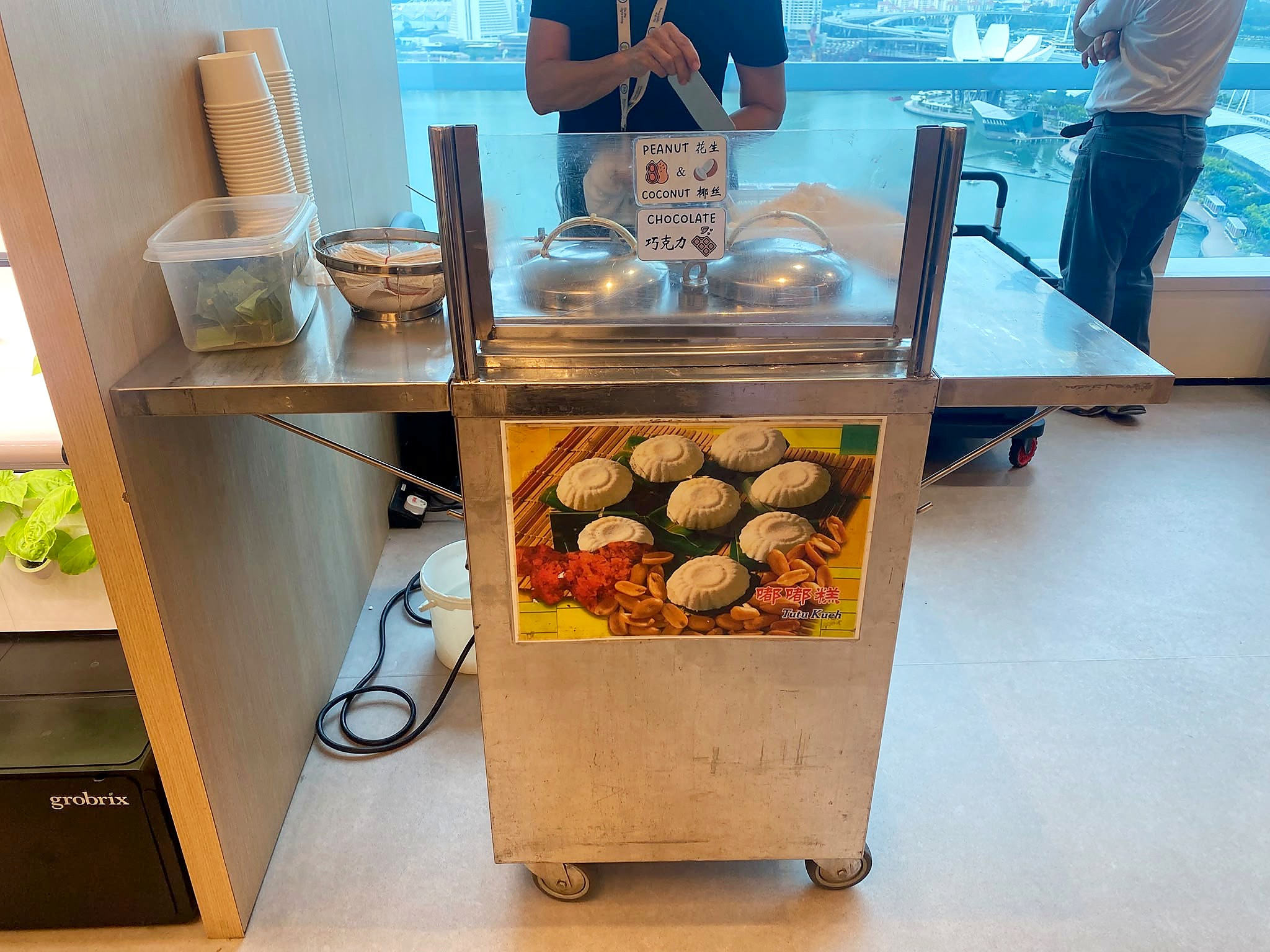 Tutu kueh cart with steamers and serving cups