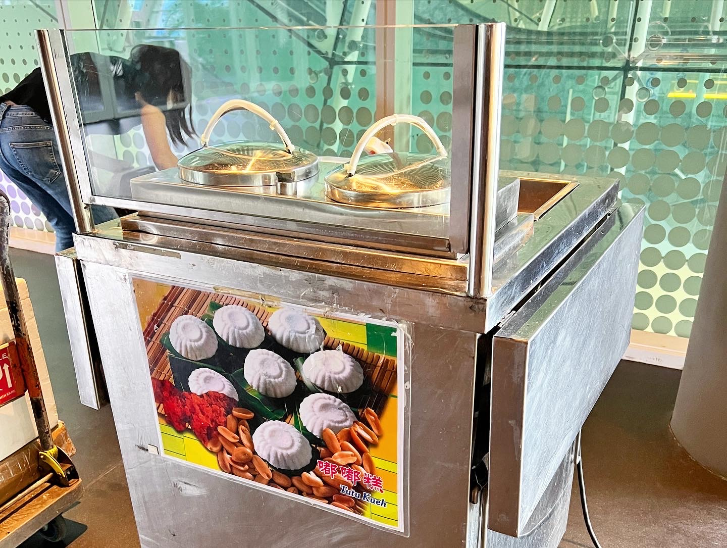 Close view of a tutu kueh steamer cart